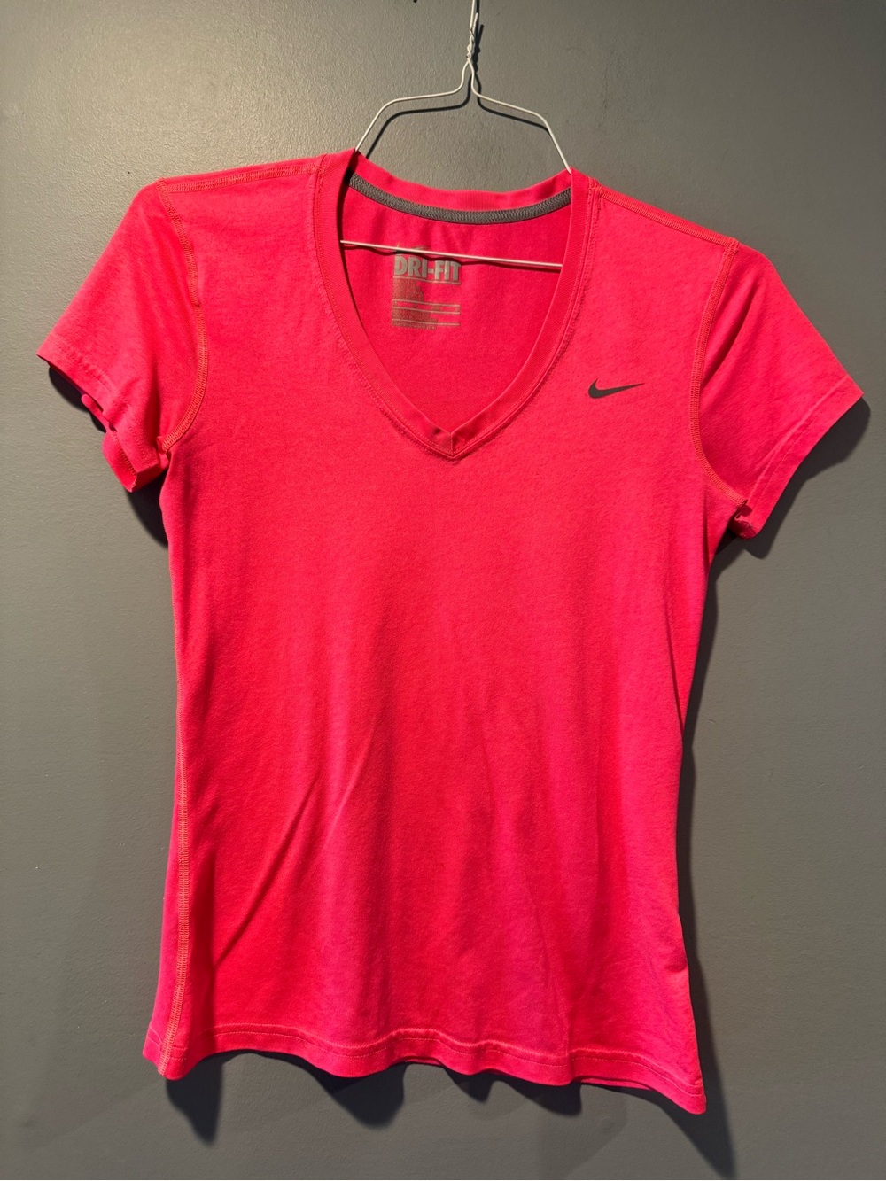 * Woman’s Pink Nike V/Neck Tee